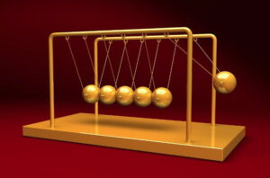 Newtons Cradle demonstrating a classical world trying to answer the following question What is the difference between classical and quantum worlds